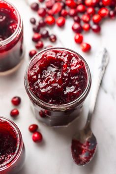 cranberry sauce in small glass jars with spoons