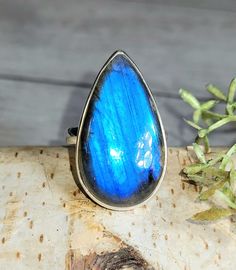 "Natural AAA Grade Blue Flash Pear Labradorite Handmade .925 Sterling Silver Ring Size 7.5 8.2 Grams 1 1/8\" x 3/4\" GR13. This is a handpicked natural stone, the exact one shown in picture.  The sterling silver is .925 and stamped.  Each piece is hand made by artisans in my shop.  The quality of the stones and the silver workmanship is impressive.  Please look at other items in my store.  I sell ready made jewelry with hand crafted silver work, pendants with a sterling silver bails and beautiful unique cabochons for jewelry wire wrapping and weaving. You will pay exact amount on shipping plus $1 for supplies and labor. All items are shipped within a couple of days after payment and are shipped USPS first class or international first class.  Items are available for combined shipping, if in Unique Blue Labradorite Ring, Blue Labradorite Rings As Gift, Blue Labradorite Rings For Gift, Blue Labradorite Rings For Gifts, Gift Blue Labradorite Rings, Blue Labradorite, Labradorite Ring, Silver Work, Blue Rings