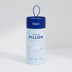 a blue and white canister with the word the nap pillow on it's side