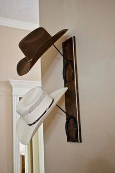 a cowboy hat and sunglasses hanging on the wall