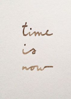 the words time is now written in cursive handwriting