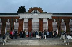 a group of people standing in front of a building