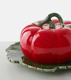 a red pepper sitting on top of a plate