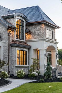 a large brick house with lots of windows