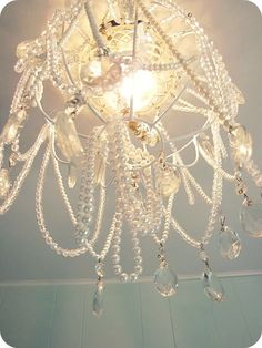 a chandelier hanging from the ceiling in a room