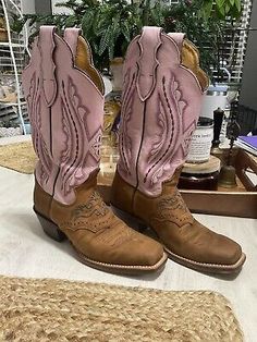 ad eBay - 

Justin Women's Cowgirl Boots Size 5 1/2 B

Brown and ("Punchy") Pink Mid-Calf Leather Boots. Heel height 1 3/4 inches. Shaft length measured from side view at top of heel on up 11 3/4 inches. Shaft length from back of heel on up 9" on up to 12" and from top of arch 6 1/2 inches on up to 9 inches. Made in the USA. Square toe. 

 

 These beautiful boots are about as new as used can get inside and out. 

Wear is very minimal 

Pre-owned Fitted Casual Boots For Country Events, Southwestern Fitted Boots With Round Toe, Western Boots For Rodeo In Winter, Western Style Boots For Rodeo In Winter, Western Style Winter Boots For Rodeo, Pink Round Toe Ranch Boots, Pink Round Toe Boots For Ranch, Pink Snip Toe Boots For Western-themed Events, Pink Western Boots For Ranch