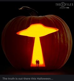 a large pumpkin with an image of a mushroom on it's face and the words, the truth is out there this halloween