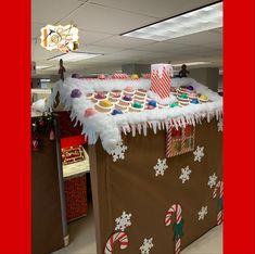 a large gingerbread house covered in icing and candy