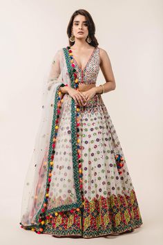 Ivory lehenga with attached cancan, highlighted with applique floral embroidery, sequin embellishments and drawstring at the side with pompoms. Comes with plunging neckline padded blouse and tulle pink dupatta.
Component: 3
Embroidered
Neckline: V-Neck
Sleeve Length: Sleeveless
Fabric: Lehenga and Blouse: Georgette; Dupatta: Tulle
Color: White
Applique, resham and patra embroidery
Embroidered blouse with tie-up at the back
Cutout at the back
Embroidered dupatta with pompoms at the hem
Closure:
B Bohemian Wedding Lehenga With Resham Embroidery, Bohemian Lehenga For Reception With Zari Work, Bohemian Lehenga With Mirror Work For Reception, Bohemian Lehenga For Reception With Traditional Drape, Bohemian Lehenga With Sheer Dupatta For Wedding, Bohemian Wedding Lehenga With Sheer Dupatta, Bohemian Anarkali Set With Mirror Work For Reception, Bohemian Choli For Diwali Reception, Multicolor Bohemian Choli For Reception