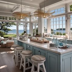 a kitchen filled with lots of counter top space next to an open window covered patio