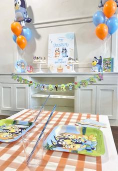 a birthday party set up with balloons and decorations