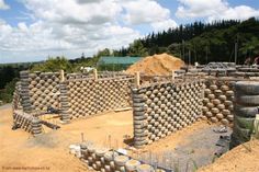 a construction site with several large tires stacked on top of each other