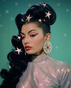 a woman with stars in her hair and makeup