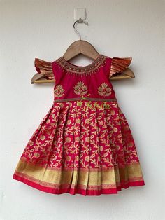 BUYER'S PLEASE LEAVE YOUR CONTACT NUMBER. It's necessary for shipping. READY TO DISPATCH Age: 0-2 Years. Baby girls dark pink silk and Banarasi chanderi brocade frock. The Yoke portion of frock made with soft silk with floral butta design and the skirt portion is made on Banarasi chanderi brocade- chanderi silk fabric. The dress is fully lined with soft cotton and the stitches are concealed. So your little princess feels comfortable in this frock. Please Visit Our Shop For More Unique Collection Kerala Half Saree, Dark Pink Saree, Onam Dress, Pink Frock, Newborn Baby Girl Gifts, Baby Girls Dresses, Sarees For Girls