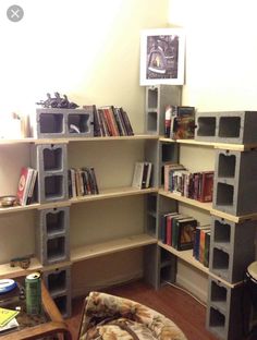 a living room with several shelves filled with books