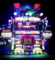 a large truck with lights on it's sides and some decorations on the back