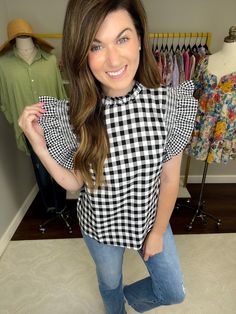 Gingham and ruffle sleeves makes for one of the sweetest tops ever! Not only is it sweet but it's versatile, too! You can style it with shorts, jeans, or trousers. We love it for the office but it's just as good for weekends. We think this will be a top that you turn to over and over regardless of what season it is! This is non-sheer. Top measures 24" in length. Bust measures 20" from underarm seam to seam. Measurements taken on a small. Add 1" to each measurement as you go up in size. Fabric ha Sleeveless Gingham Tops For Day Out, Summer Gingham Top With Button Closure, Spring Gingham Sleeveless Top, Short Sleeve Gingham Tops With Button Closure, Gingham Button-up Tops For Daywear, Skirt Extender, Sweet Top, Deodorant Stains, Poplin Fabric