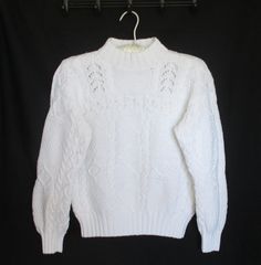 "Cable Knit Sweater Vintage White 100% Cotton Mock Turtleneck Heavy Cotton Sweater  This vintage sweater is a heavy cotton knit with beautiful cable knit designs.  This is the perfect Christmas Holiday Gift! ✅ Size: Women's Size Small See the photos for measurements. Measurements of this sweater when lying flat: Armpit to armpit: 19 1/2\" Shoulder to Bottom Hem Length: 20 1/4\" Armpit to Sleeve Hem: 16\" Bottom Hem: 13\" Excellent vintage condition for its age and use. There are no broken thread Winter Cotton Cable Knit Polo Sweater, Classic Cotton Sweater With Pointelle Knit, Winter Crew Neck Cable Knit Pattern, Winter White Cable Knit Pattern, Winter Cotton Pointelle Knit Sweater, Winter Cable Knit Crew Neck Knitting Pattern, White Cable Knit Pattern For Winter, White Cable Knit Long Sleeve Polo Sweater, Winter White Textured Knit Polo Sweater