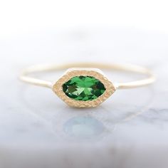 Gorgeous tsavorite garnet ring handcrafted in 14k rose gold. Truly unique and beautiful dainty ring with natural gemstone. Back of the ring features tiny heart cut out. Such a love ring is perfect for engagement, or Christmas gift for wife, girlfriend, sister. CENTRAL STONE: *tsavorite garnet, natural Earth mined gemstone with beautiful green color APPROXIMATE MEASUREMENTS OF THE RING: *head of the ring: 8mm x 4.5mm *band: approximately 1mm wide *size: please choose from the dropdown menu. If yo Fine Jewelry Tsavorite Birthstone Ring, 14k Gold Sapphire Ring For May Birthstone, May Birthstone Ring In Tsavorite, Fine Jewelry 14k Gold Green Sapphire Ring, Tsavorite Birthstone Ring For May Birthstone Gift, Tsavorite Emerald Ring In Yellow Gold For Gift, Yellow Gold Tsavorite Emerald Ring As Gift, Tsavorite Emerald Ring In Yellow Gold As A Gift, Fine Jewelry Tsavorite Rings For Gift