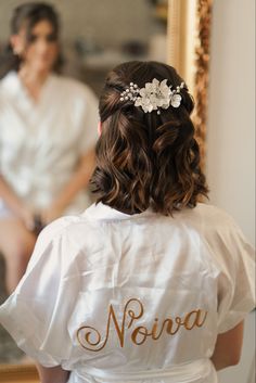 the back of a bride's dress with her hair comb in place