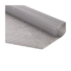 a roll of clear plastic covering on top of a white flooring mat with an area for