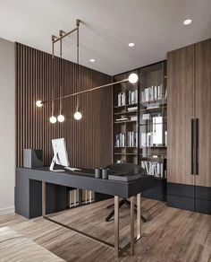 an office with a desk, bookshelf and shelves