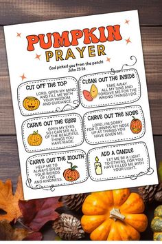 a pumpkin prayer is shown with fall leaves and acorns on the table in front of it