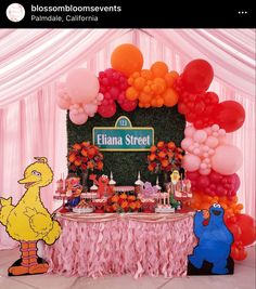 the sesame street birthday party is complete with balloons