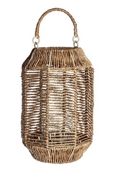 a wicker basket hanging from the side on a white background with clippings