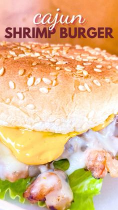 a close up of a burger on a plate with lettuce and sauce in the background