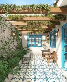 an outdoor patio with blue doors and windows