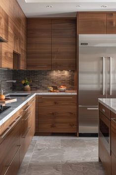 a kitchen with wooden cabinets and stainless steel appliances