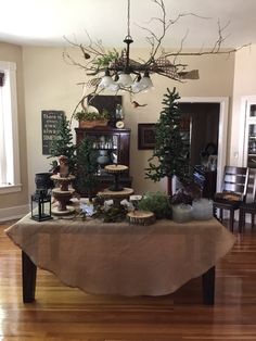 the table is covered with many different types of decorations and trees on top of it