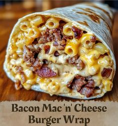 bacon mac'n cheese burger wrap on a wooden table with the title above it