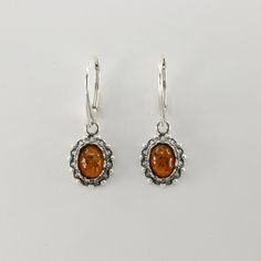 These is a pair of beautiful BALTIC AMBER Earrings from Gdańsk / Danzig, Poland. The earrings are made out of solid 925 Silver and there is no nickel or other substances causing most allergies. This makes the earrings hypo allergenic. Size of one Earring 3.1 x 1.1 cm or  1.22 x 0.43 inch Please note: Our jewelry is photographed close up to show detail and may appear larger than they are. We are happy to help with any questions. You will receive the item in a gift box - perfect to surprise someon Classic Nickel-free Oval Earrings, Baltic Amber Jewelry, Amber Earrings, Gdansk, Leverback Earrings, Amber Jewelry, Lovely Earrings, Baltic Amber, Allergies