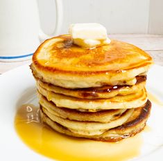 a stack of pancakes with butter on top