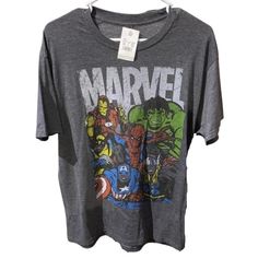 Nwt Marvel Comics Graphic Tee Shirt. Size Large. Crew Neck. Short Sleeves. Approximate Measurements Pit To Pit 21" Length 29" 3495-5 Fun Character Print Shirt For Fans, Comic-con Character Print Short Sleeve T-shirt, Comic-con Character Print Short Sleeve Tops, Cotton Top For Comic-con Fan Merchandise, Cotton Tops For Comic-con Fan Merchandise, Graphic Tee With Character Print For Comic-con, Comic-con Graphic Tee With Character Print, Comic-con Graphic Cotton T-shirt, Themed Cotton Shirt With Cartoon Print