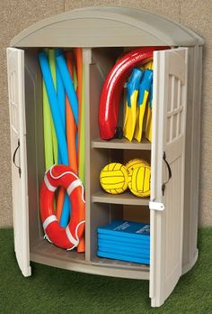 an outdoor toy storage unit with toys in it