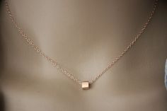 "Minimalist choker necklace, silver sterling pink gold plated with cube pendant - fine pink gold necklace - silver choker - silver cube necklace My rose gold jewelry is made with solid silver findings with 18k rose gold plating.  Necklace in pink gold silver minimalist style. Silver sterling chain with 4cm extension chain. Several lengths available. 1 silver pink gold cube bead 5mm is mounted on the chain. Do not hesitate to contact me if you want another length. ♦ All my jewelry is made to order according to the dimensions you have chosen. Please check your measurements carefully. ♦ My jewelry is also delivered \"ready to offer\" and packaged in a pretty gift bag. Sending neat. For further information, please feel free to contact me via the tab \"contact the creator\" (answer within 24 ho Rose Gold Square Pendant Jewelry In Sterling Silver, Rose Gold Sterling Silver Square Pendant Jewelry, Minimalist Jewelry With Delicate Chain And Square Pendant, Minimalist Jewelry With Delicate Square Pendant, Minimalist Pink Gold Jewelry For Gifts, Minimalist Pink Gold Necklace For Gift, Minimalist Pink Gold Jewelry As Gift, Minimalist Rose Gold Charm Necklace With Delicate Chain, Simple Rose Gold Jewelry With Clavicle Chain