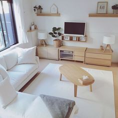 the living room is clean and ready to be used as a home office or work space