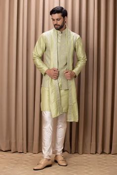 Mint green nehru jacket in cotton silk base fabric with intricate embroidery.
Component: 1
Pattern: Embroidered
Neckline: Mandarin Collar
Sleeve Type: Sleeveless
Fabric: Cotton Silk, Lining: Twill Satin
Color: Green
Other Details: 
Note: Kurta, pant and stole worn by the model is not for sale
Occasion: Mehendi and Puja - Aza Fashions Nehru Jacket For Men, Sleeveless Kurta, Nehru Jacket, Couture Outfits, Nehru Jackets, Mens Luxury Fashion, Embroidered Neckline, Intricate Embroidery, Churidar