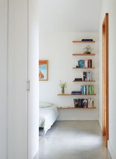 the room is clean and ready to be used as a book shelf for bookshelves