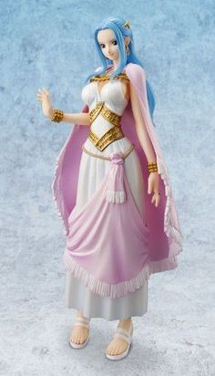 a figurine is dressed in a pink and white dress with gold trims