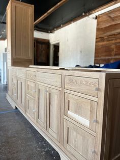 an unfinished kitchen cabinet is shown in this image