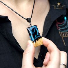 "Wooden HOWLING WOLF necklace for women. Wood resin pendant necklace. GLOW in the dark. Resin art jewelry. ♥ This item is handmade, so each piece is unique. The piece you receive will be based on this design and very similar to photos. ♥♥ Please see the current discounts in the shop announcement: https://www.etsy.com/shop/TSMDecorations Unforgettable Exclusive Birthday Gift. Handmade from Australian BROWN MALLEE burl wood and clear art resin. Male or female pendant with a Howling wolf on an illu Resin Art Jewelry, Glow In The Dark Resin, Witch Necklace, Wolf Necklace, Resin Pendant Necklace, Wolf Jewelry, Howling Wolf, Magical Jewelry, Art Resin