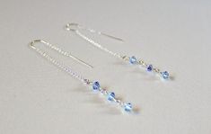 "These light blue Swarovski dainty threader earrings are handcrafted by me. Perfect gift for bridesmaid pr prom jewelry! Handcrafted by me by wire wrapping Lt Sapphire AB  Swarovski crystal 4mm bicones to sterling silver threader ear wires. These earrings are not just stunning and fashionable but they are very comfortable to wear. The earrings dangle approximately 2 3/4\" from your earlobe. I use the threaders with the \"U\" in them, which sit nicely and securely in your earlobe. Click on the li Daughter Bridesmaid, Bloodstone Jewelry, Silver Threader Earrings, Blue Dangle Earrings, Light Sapphire, Prom Jewelry, 21st Birthday Gifts, Blue Bridesmaids, Threader Earrings