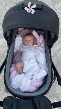 a baby in a stroller is laying down