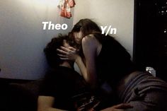 two people laying on a bed with their heads touching each other and the words'theyo yn'in front of them