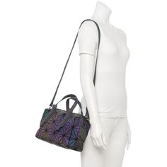 This AmeriLeather Medina luminous geometric handbag's understated dark hues match any outfit, while in the dark if shined on with light they will transform to illuminating gems that will add to your inner sparkle. This AmeriLeather Medina luminous geometric handbag's understated dark hues match any outfit, while in the dark if shined on with light they will transform to illuminating gems that will add to your inner sparkle. 7.75"H x 10.5"W x 4.75"D Handle: 4'' drop Crossbody strap length: 34" to Modern Satchel With Adjustable Strap For Parties, Modern Geometric Bag With Adjustable Strap, Modern Geometric Shoulder Bag With Adjustable Strap, Geometric Bag With Adjustable Strap, Geometric Evening Bag, Everyday Geometric Bag With Adjustable Strap, Geometric Shopping Bags, Crossbody Strap, Fashion Handbags