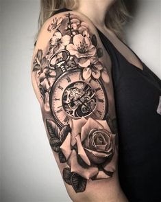 a woman with a clock and roses tattoo on her arm